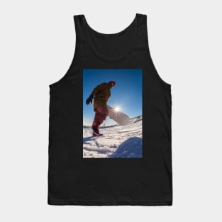 Snowboarder walking against blue sky Tank Top